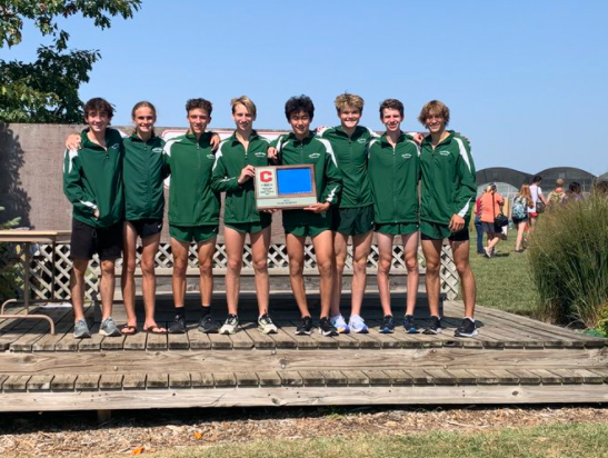 The Millard West boys varsity team poses for pictures after bringing home first place in the meet. Each runner competed very well and all seven of them finished inside of the top 35. “We were very very happy with the win,” Fey said. “We beat regionally ranked teams that we had no clue about how good they were until the gun went off. We also know that we’re looking good to win the state championship and maybe finish top two team wise at Nike Cross Regionals to be the first Nebraska team to ever make Nike Cross Nationals.”