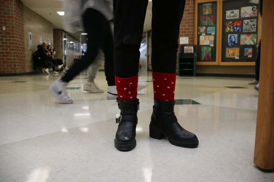 Senior Gabby Collins shows off her festive polkadot socks during spirit week.