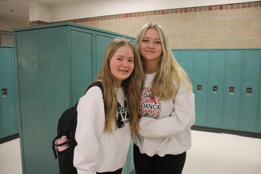 Freshman Ana Larson and Avery Goshorn wearing white for their grade level.