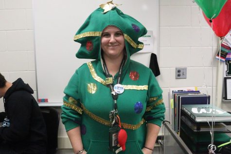 History teacher Angela Bosak taking ungly sweater day to the next level in her Christmas tree sweater.