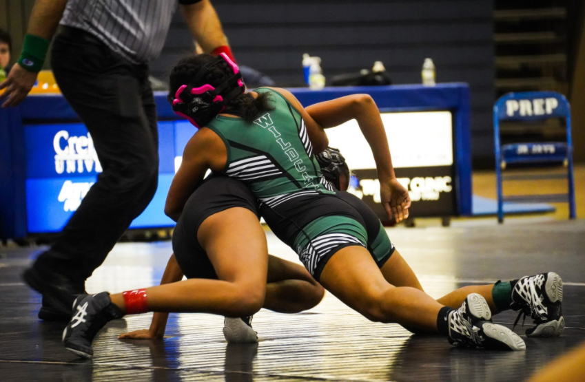 The Millard West Girls Wrestling team takes on a dual with Marian. With this being the first year of the team they hope to improve and better their skills throughout the season. “My goal for the whole team is to better themselves every day,” senior Macy Klein said. “Wrestling is demanding, physically and mentally,  and I believe that it will make all of us exceptionally better people and leaders. It will show, and has shown, that each of us are strong, capable and resilient no matter the circumstances.”