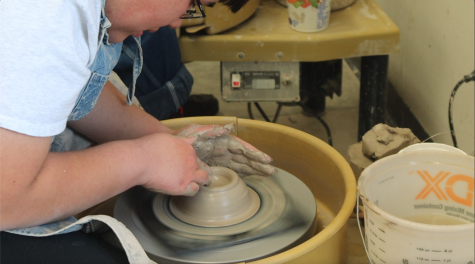 Senior Adam Mar works hard in his advanced pottery class to create a bowl on the wheel. Throughout the semester Mar has become more confident in his abilities as he learns new techniques and gains a new skill set. “I’ve seen Adam progress just in the way that he opens up more to the material that we work with,” advanced pottery teacher John Kirke said. “Now that he seems more relaxed and invested in it, Ive seen him laugh and smile this semester more than I have the entire four years.” 

