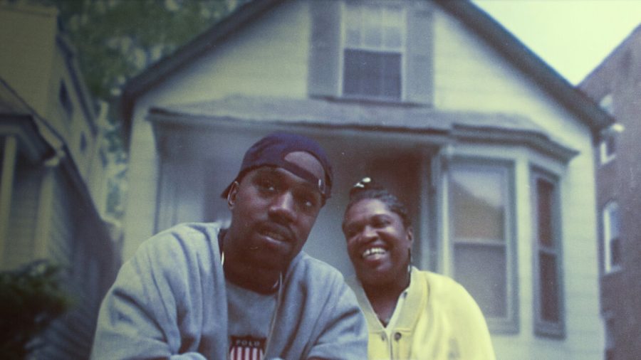 Rapper Kanye West sits next to his mother, Donda West, in front of their home in South Shore, Chicago as they reminisce on Kanye’s journey to fame.