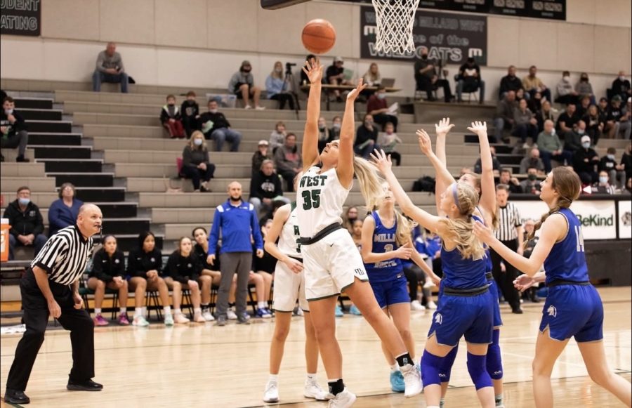 Senior+Gwyneth+Stocker+attempts+a+layup+during+her+senior+night+game+against+Millard+North.+The+Wildcats+would+end+up+pulling+off+the+upset+against+the+Mustangs%2C+sending+Stocker+out+with+a+victory.+%E2%80%9CMy+favorite+memory+from+this+year+in+terms+of+basketball+so+far+was+beating+Millard+North+at+home+on+senior+night%2C%E2%80%9D+Stocker+said.+%E2%80%9CNot+only+did+we+beat+the+number+5+team+in+the+state%2C+but+we+won+on+what+could+have+been+my+last+home+game+ever.%E2%80%9D+%0A%0A