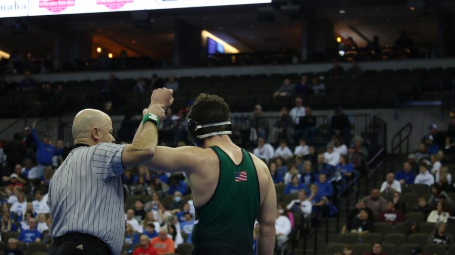 Sophomore Noah Blair gets his hand raised after picking up a semi finals win.