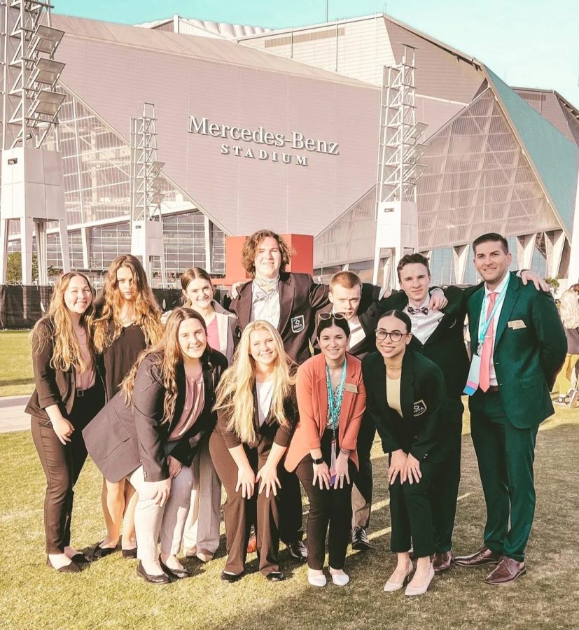 Millard West DECA outside the Mercedes-Benz Stadium in their trip to Atlanta for the DECA International Competition. The event lasted from April 23-26 with the students eligible to achieve widening of their skills in each of their respective topics. “I would really just encourage people to join DECA because it’s a great resume builder. Along with giving students just general life skills that are going to make them competitive in any career,” DECA sponsor Ashley Dworak said. “Really, a lot of the competitions and things we do are centered around business content, but all of the skills in which they’re learning and improving on is really gaining practice for them.”