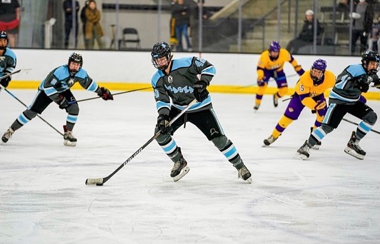 Sophomore Burke Newton in one of his games with the puck, getting ready to score. While the season ends in March, Newton is already thinking about his future. “When the season ends, I’ll want to come back and play for the team, I like it here,” Newton said. “Great school, it’s definitely different and the size is much bigger, football games are awesome.”