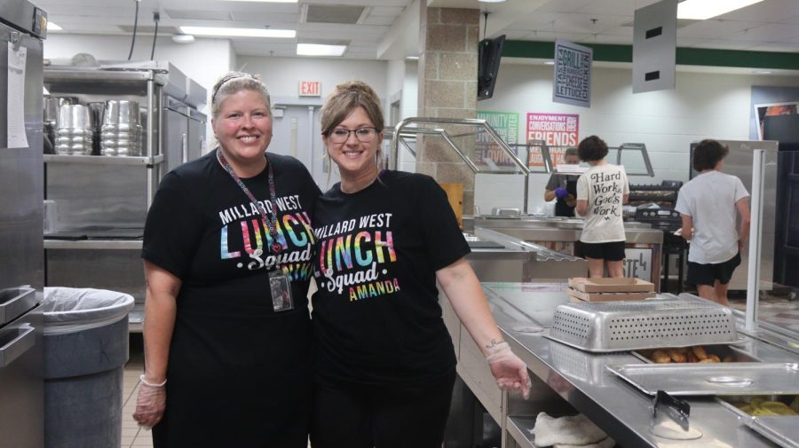 Nikki Annin (on the left) works alongside Amanda Mitchell (on the right) as they serve food to 1st lunch.