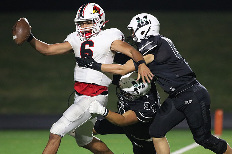 Defensive+tackle+Hudson+Meier+and+linebacker+Braedyn+Kiger+rally+to+sack+the+South+Sioux+City+quarterback.+Millard+West%E2%80%99s+defense+was+attacking+all+day+and+held+the+Cardinals+to+just+49+total+yards.+%E2%80%9CIt+feels+great+when+the+defense+is+able+to+get+the+shutout%2C%E2%80%9D+sophomore+Jake+Blackman+said.+%E2%80%9CIt+gives+us+the+confidence+that+we+can+lean+on+the+defense+to+keep+us+in+the+game+when+the+offense+is+struggling.%E2%80%9D