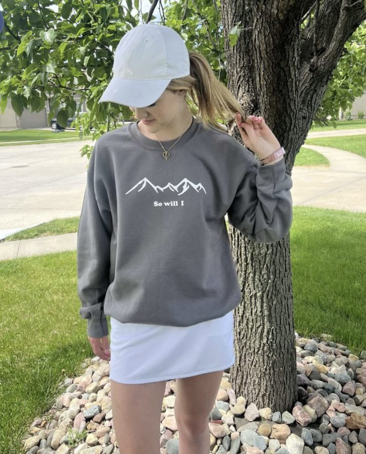 Kates model showcases one of the first designs. This is the first crew neck offered by Anchored by Faith. The intent of this crew was to make a both cute and meaningful design.


