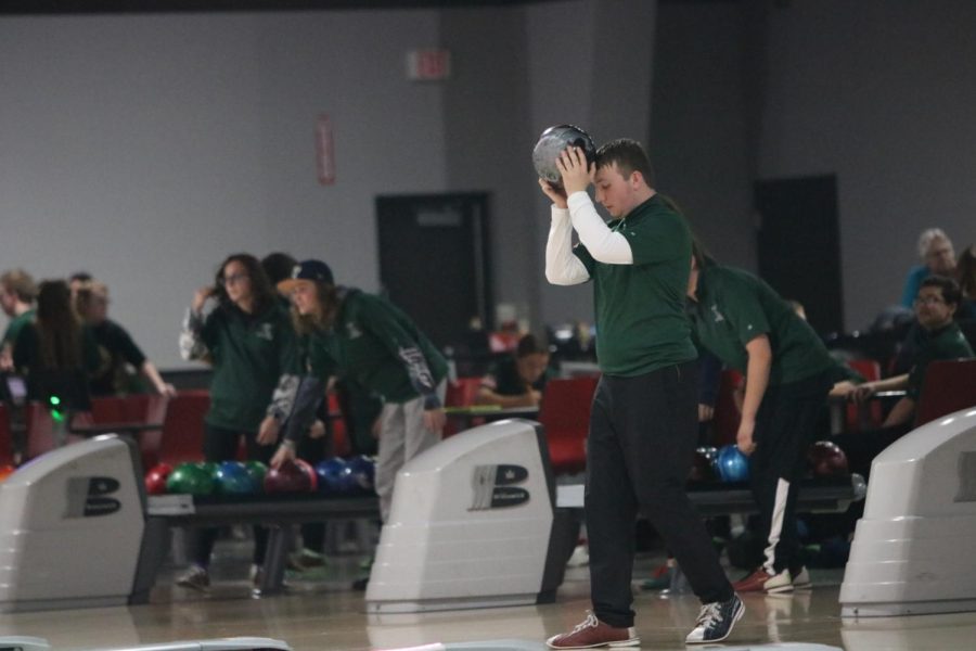 Senior Jack Carrol getting ready to throw the bowling ball down the lane. “The athletes bowl in a bakers format,” ACP teacher and coach Bret Seipker said. “This allows all members to participate equally.”
