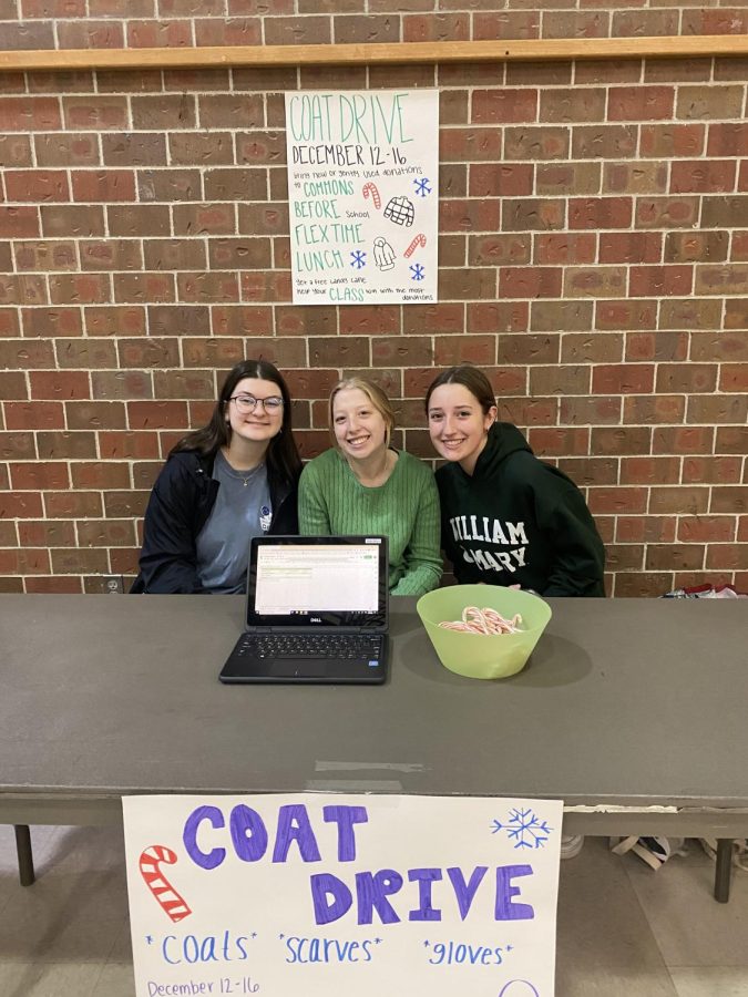 Kelsey Nunnenkamp, Skylar Ostronic, and Kali Oleson collect donations for the Winter Clothing Drive.