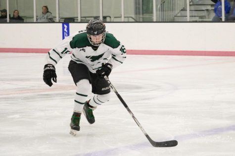 Junior Edwin Patchen skates down the ice to grab the puck for the Wildcats. Millard West was on a power play and Patchen wanted to get the puck back to offense as soon as possible so they had more scoring opportunities. “I think we were relaxed because we knew we could beat them cause we had beaten the teams that they had tied to or lost to,” Patch said. “But I also think as we were getting ready to step onto the ice we were starting to get serious and ready to win.” Millard West has finished the regular season and is now preparing for the playoffs.