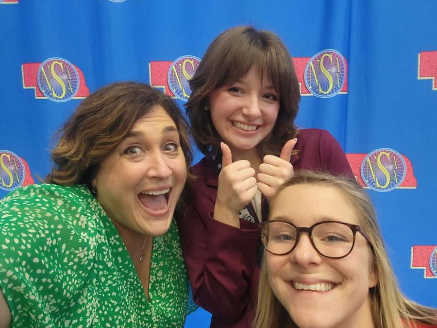 Celebrating a first place championship in informative speech, senior Gretna John poses for a selfie with Forensic coaches Jennifer Jermome and Rachel Vanengen.