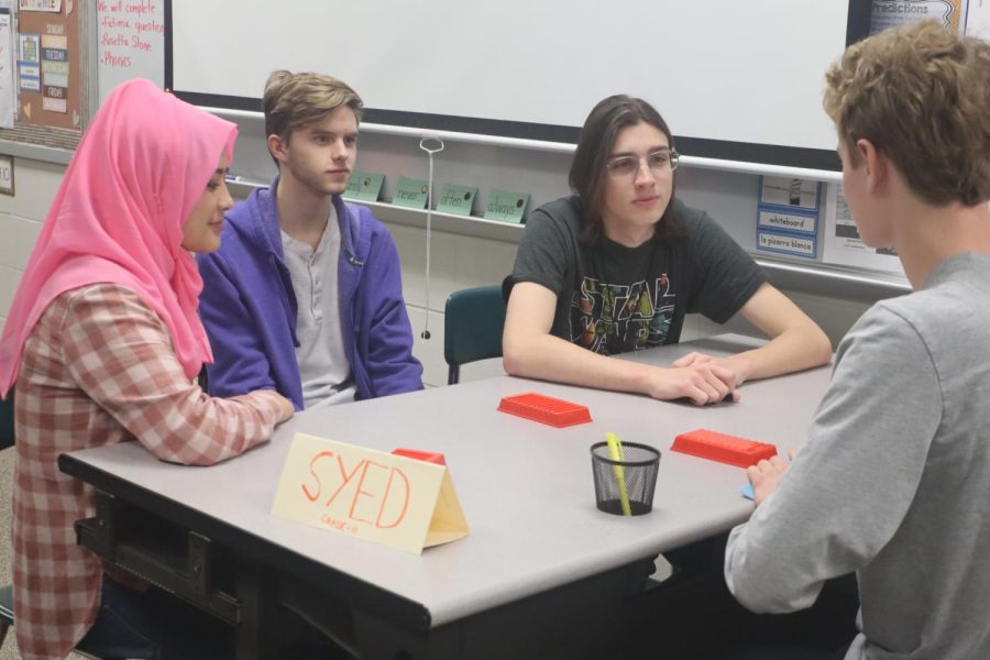 The EL students play board games with other students. This allows them to be exposed to other students who speak English.