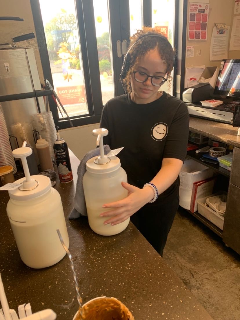 Senior Amelia Booker working a closing shift at Scooters after finishing a full eight period day of school. She started working at Scooters a year ago to have money for herself, and with them being known for their flexible schedule, she chose to work 15-20 hours a week while balancing schoolwork. “Being able to work a job and have good grades is something not a lot of students can do,” Booker said. “Even if they are able to get good grades, taking your time to understand the information is most important. I have found a perfect balance that keeps me busy at school and work, which kind of shows me how life in college and beyond will be.”


