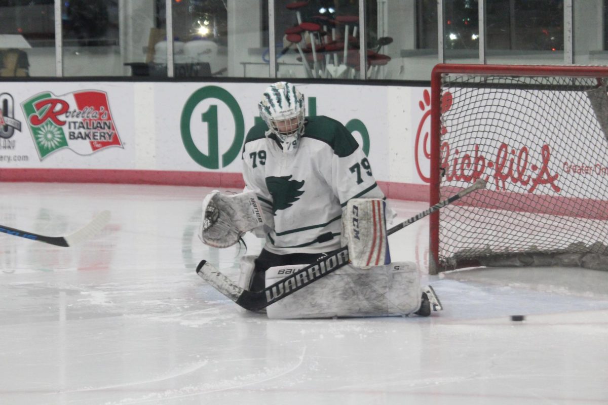 Senior+goaltender+Seamus+Bygrave+denies+a+shot+with+his+left+pad.+The+senior+netminder+had+24+saves+en+route+to+the+Wildcats+dismantling+of+Elkhorn+in+a+6-1+victory.+%E2%80%9CI%E2%80%99m+excited+for+the+new+season%2C%E2%80%9D+Bygrave+said.+%E2%80%9CIt%E2%80%99s+my+11th+year+playing%2C+so+I+definitely+want+to+make+the+best+of+it.+I%E2%80%99m+definitely+optimistic+about+this+year.%E2%80%9D