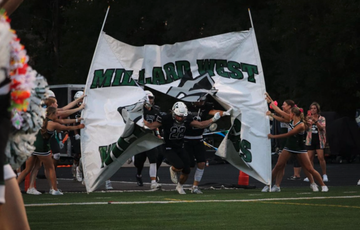 Leading the charge on defense, senior defensive back Jon Furgeson rips through the Millard West banner. In what could be the final “Millard v Millard game of his football career, Furgeson was an emotional leader both on and off the field. “It was a pivotal moment for us, especially going into district play,” Furgeson said. “It was important to get that win, especially falling short against Millard South. That win felt good.”