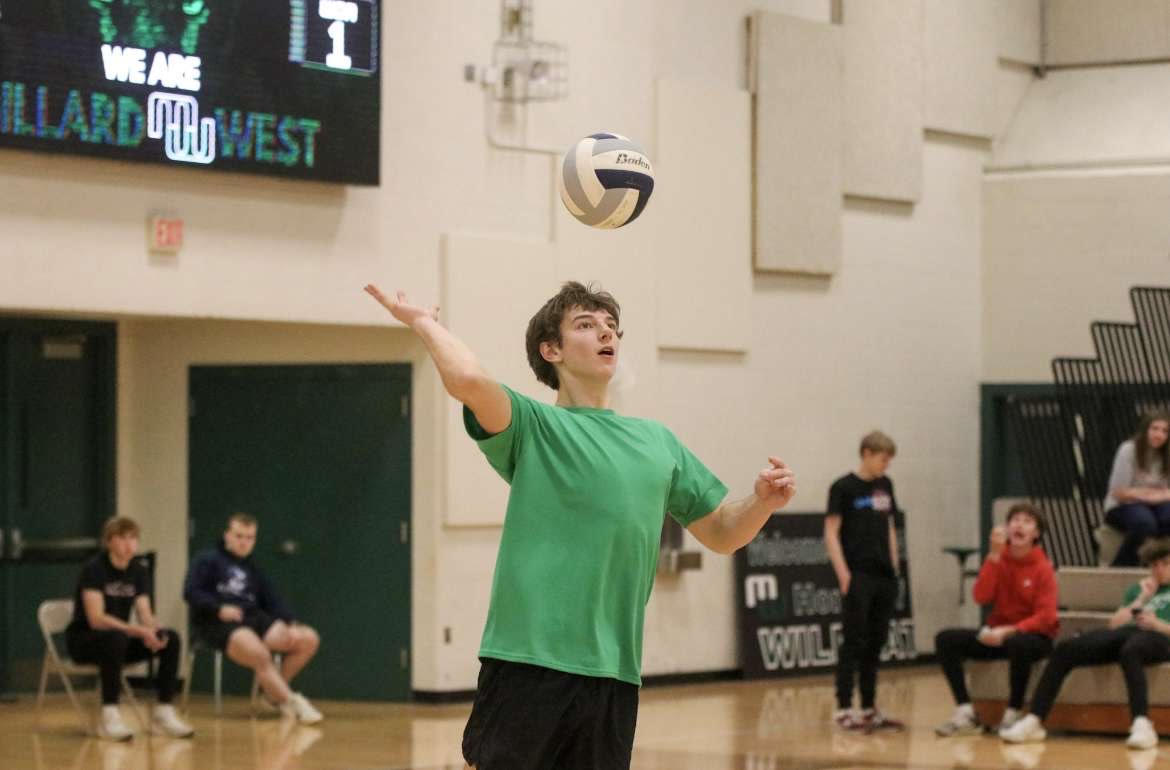  In pursuit to serve, senior Jordan Gassen prepares to hoist the ball over the net in search of an ace for his team. It was now the third set, and Green was looking to get points on the board. ‘’I wanted to give the squad a fighting chance in this set,’’ Gassen said. ‘’Even though we lost, I’m glad we went down trying.’’
