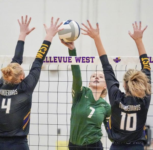 Hitting the ball over the net, senior Kaelin Pribyl tries to avoid the block from Bell West. In the District Championship, the Wildcats lost to the T-Birds 3-1. Our strengths throughout the game were staying in system with out passing, which keeps all hitters available as an option, and staying disciplined with our blocking against their biggest hitter, Pribyl said. We knew they were a great team but we didnt let that stop us from playing to win, rather than playing to not lose.