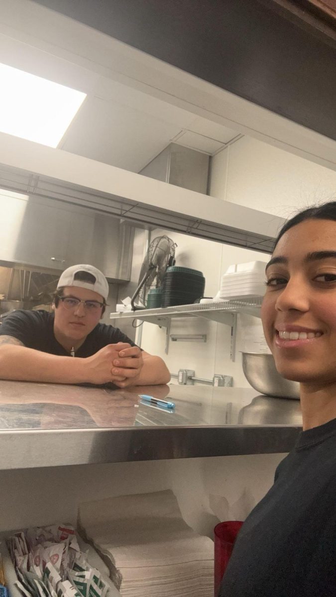 Sophomore Iman Khalil helping around at her job with her friend. Khalil started working at her friends family owned bar a year ago. She has been described as a great server and has really nice customer service.  I really like working there, Khalil said.  I get to work with my friend and plus, I know who the owners are and am close with them as well.