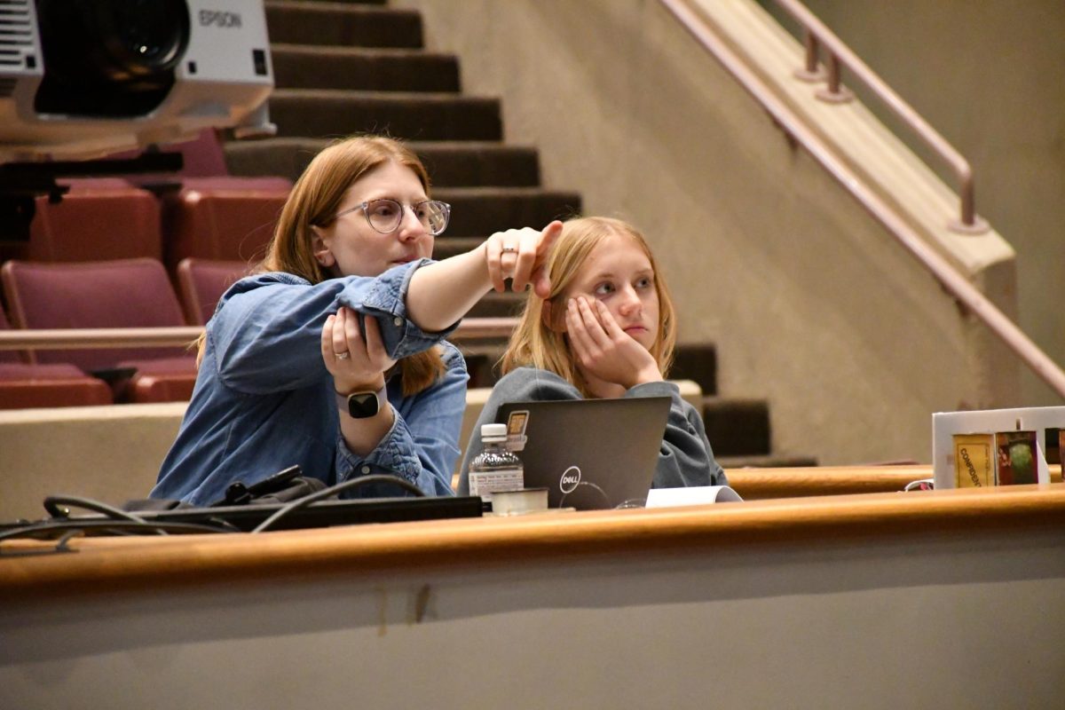 Brooke Phillips directing a play along with an assistant director. “I had a wonderful experience here and because I wanted to be a teacher I decided to mix my passions for theater and teaching,” said Phillips.” So I came back here to become the director of the theater program.”