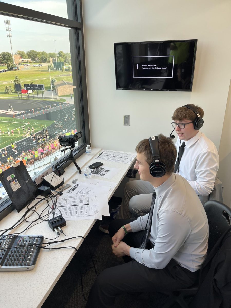 In+the+press+box+at+Buell+Stadium%2C+Nathan+Delaney+and+Logan+Moseley+commentate+over+a+Wildcat+football+game.%0A