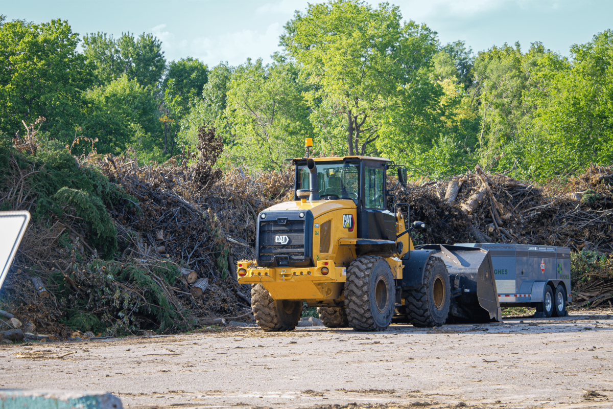 A front end loader parked at the temporary storm debris drop-off zone on 156th and F Street.