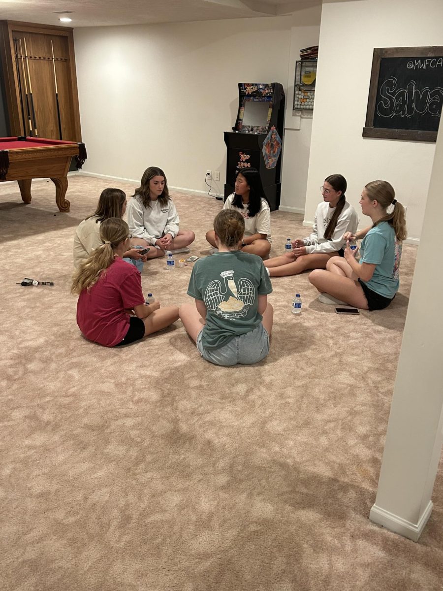 Students split into groups to discuss the message of salvation and how it applies to their lives. They eat snacks, get to know each other and by sharing their stories they can walk together in the tough journey of life through God. “My favorite part about FCA is discussing and processing God's word with others,” sophomore Brianna Jochims said. “And also the fellowship of all the Christians that gather together.”