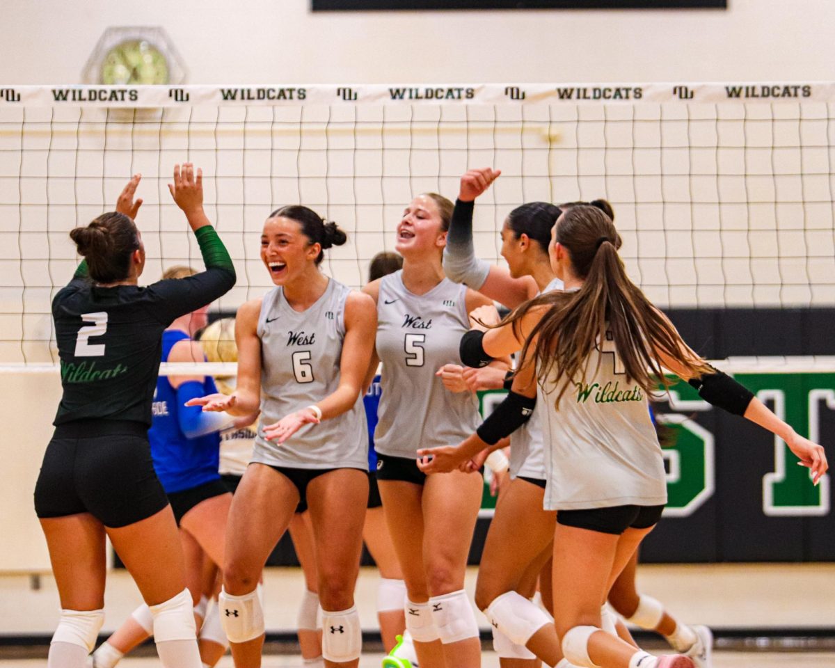 Following a kill, senior Hayden Hart celebrates with her teammates. Hart played a crucial role and racked up several kills en route to the Wildcats sweep of the Titans. “We need to leverage the confidence and momentum we gained from that win,” Hart said. “Continuing to refine our skills on the court and focus on consistency by maintaining strong team culture and staying dedicated during practices will help us continue to grow as a team.” 