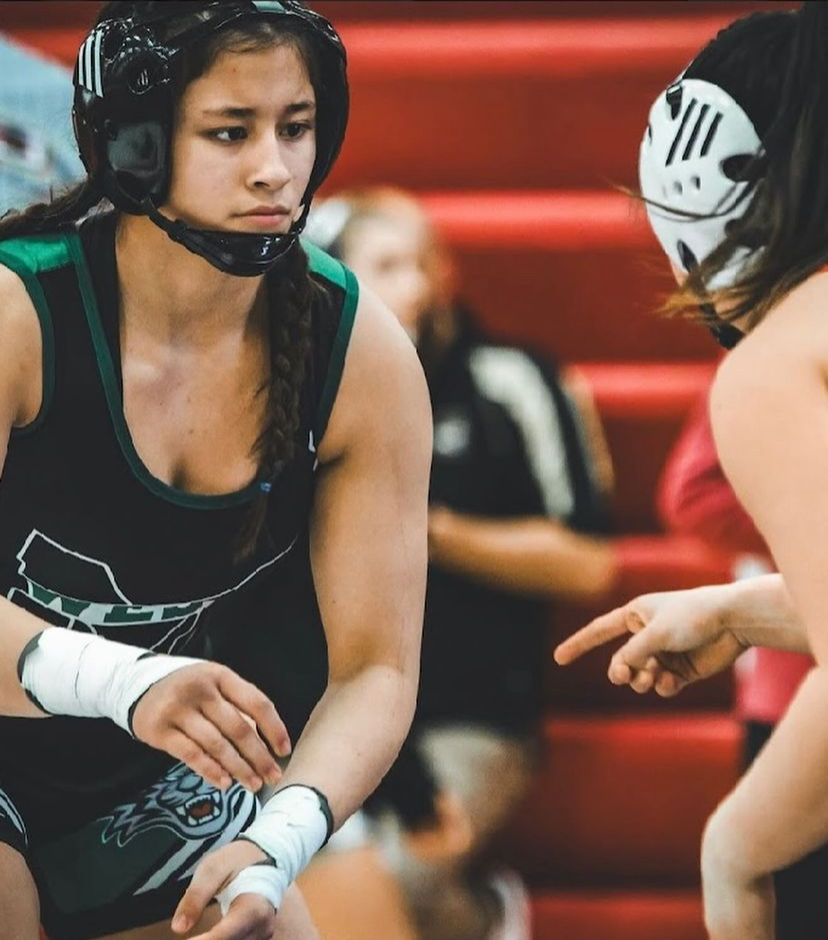 Senior Ximena Galarza prepares to start a match with her opponent during a tournament. She has been wrestling for Millard West for a year now and has no plans to leave the team. “I think that's the best part for me. If I don’t get hurt during a match it wasn’t a good match,” senior Ximena Galarza said.“If I get hurt, I know it was a good fight.”

Photo courtesy of Ximena Galarza