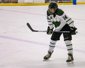 Awaiting the puck to drop, senior defenseman Cole Grandgenett positions himself to receive the puck. Grandgenett’s goal helped lift the Cats past Elkhorn North along with his great defensive play and leadership. “I am expecting a good run this year,” Grandgenett said. “I think after we get things together and our feet under us, we can figure it all out from there.”