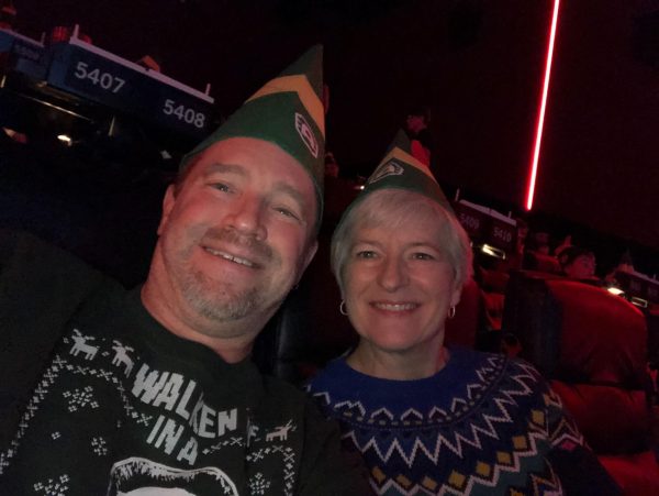 English teacher Michael Davis watches the Elf Christmas movie party at the Alamo with his wife Darci Davis. As they put on fun hats and took their seats, the Davis’s got to experience this wonderful Christmas memory. “We haven't gone every year but when we did it was amazing,” Davis said. “It was a whole experience with a fun party and of course the movie. My wife and I couldn't have had more fun.”