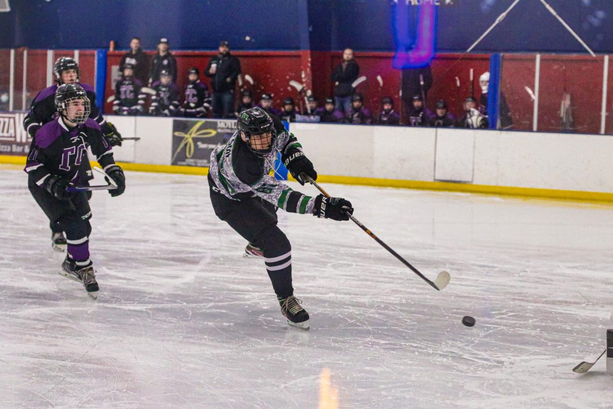 Firing the puck on a breakaway, senior captain Reece Wilson looks to add to the lead. Wilson’s five-goal performance propelled the Cats past Gretna for the second time this season. “We noticed Gretna’s defense tends to play a little off, giving you more time and space,” Wilson said. “It was also just good positioning on our end that led to more opportunities and chances to score. After a unique game like that, I think it’s super important to feed off that energy and get the other guys fired up wanting to score and find opportunities.”