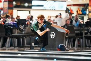 Eying down the pins at the end of the lane, junior Anden Sutter, flings the ball out of his grip. Sutter placed first at the NSSA State Bowling Championship for the 2025 season. “It was a pretty crazy feeling to win the whole thing,” Sutter said. “Keeping my cool and staying relaxed even when playing challenging opponents really helped me succeed in the long run.”