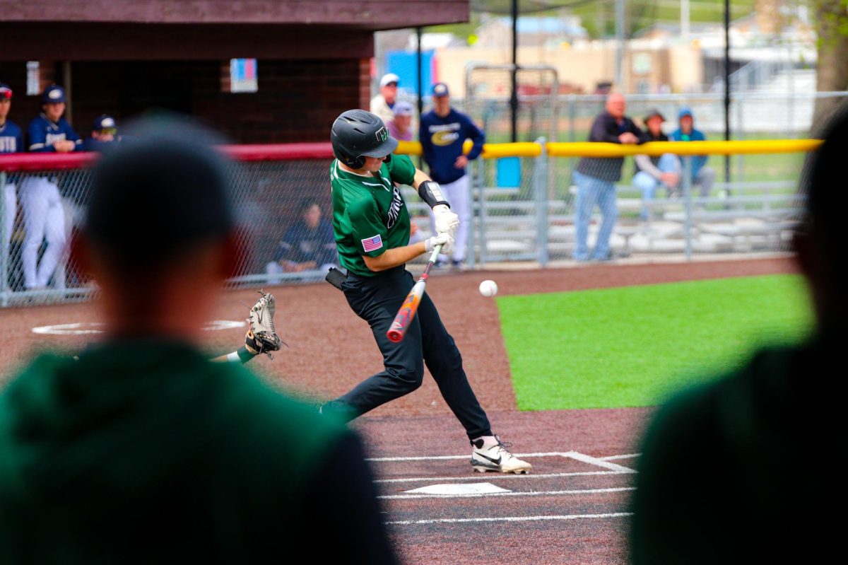 Taking a swing, senior infielder Landon Horst puts a charge into a ball against Elkhorn South. The senior credits a large part of his hot hitting and production to playing summer baseball in Atlanta while also keeping a clear head in the box. “When I go up to hit, I try not to think at all,” Horst said. “I feel I am more successful when I have a clear head rather than trying to do something and having that take focus away from the actual pitch coming at me. I’m looking for pitches that I can handle, especially early in counts like anything belt high and middle in."