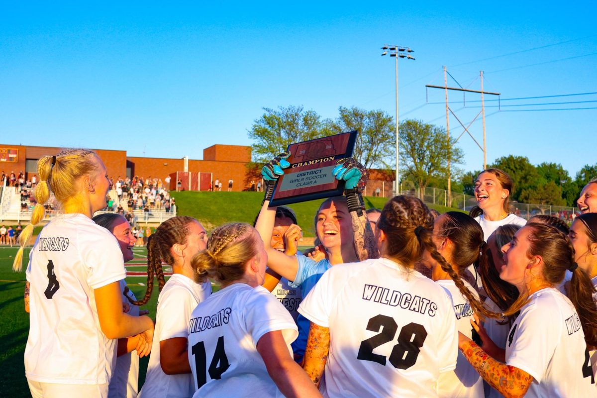 Jumping for joy, junior Leah Pugliese celebrates as the Wildcats defeat the Papillion-La Vista Monarchs in the A-7 district final. The Wildcat’s knew they needed to bring their A game to have success throughout the game. “We were so happy with the performance that we had for the game,” Pugleise said. “We just want to keep our season going so the seniors get more opportunities.” 