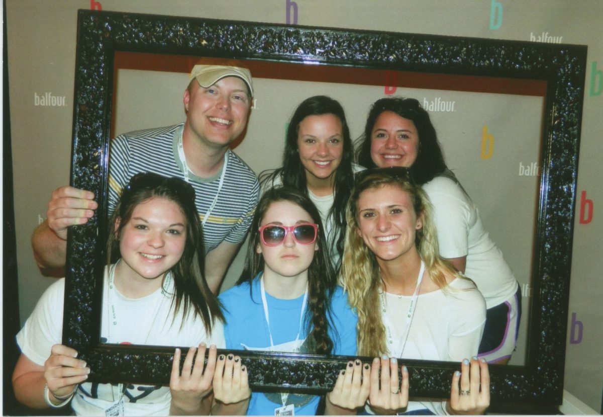 Journalism adviser Mark Hilburn poses with some Yearbook students at a national journalism convention in San Diego. 