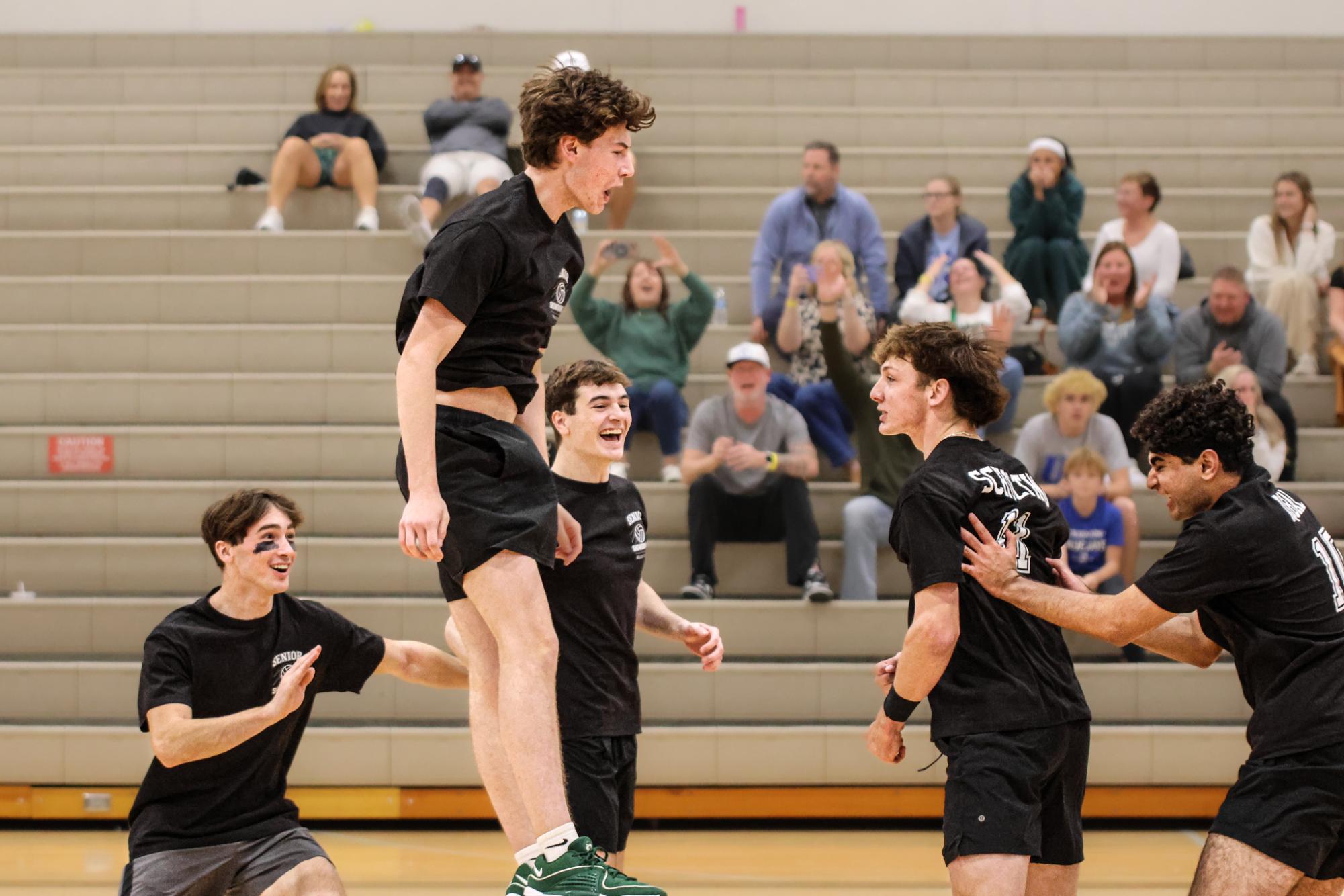 Celebrating after a huge second set comeback for a win, senior Evan Ward jumps in to cherish this moment with his teammates. The black team won a back a fourth battle in the first set, and the second set looked like it would sway towards green after a huge 12-2 lead, until hitter Rowen Scholting got more comfortable with his swing and connection with the setters. The black team was unstoppable.  