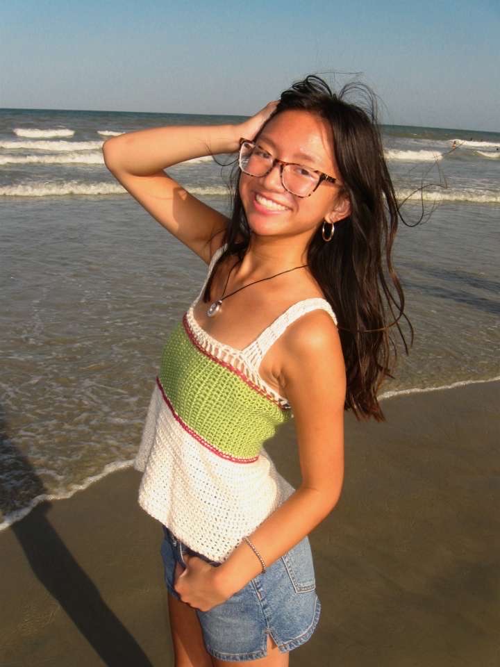 Posing to promote her business, junior Haven Dalke hopes to earn traction with her new post. Making a new piece brings her joy, and being able to make a piece for someone else gives her a rewarding feeling. "My favorite things to crochet are sweaters and tops," Dalke said. "I get to make my own designs and experiment with measurements and ew techniques."