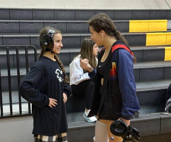 Getting ready for competition, the Hoegemeyer sisters encourage eachother before they hit the mat. “My sister is my biggest supporter,” Maria Hoegemeyer said. “ We are always there for each other and keep one another accountable.”
